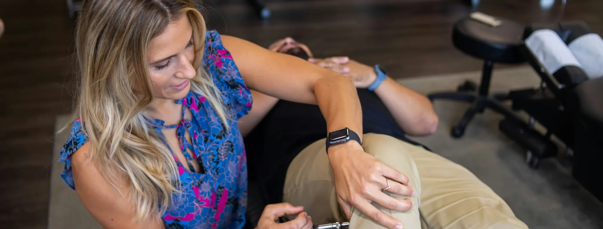 A patient and physical therapist at physical therapy