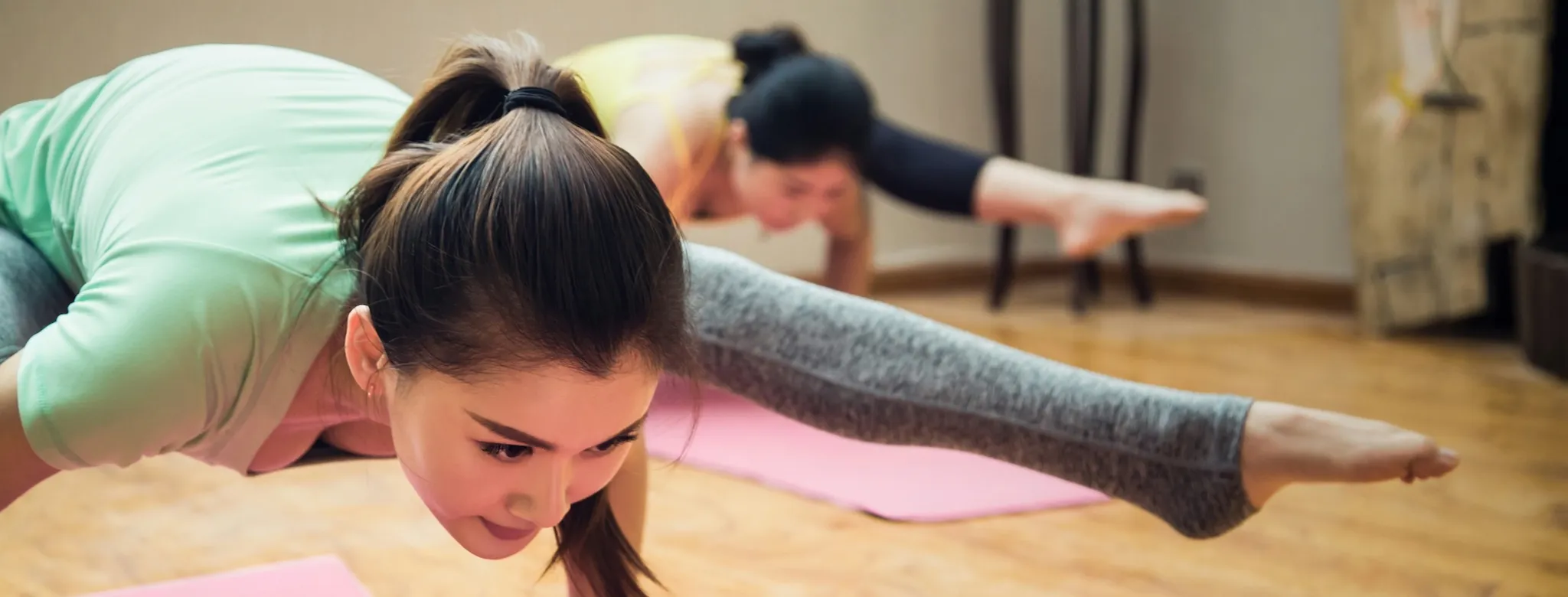 2 women in a yoga class