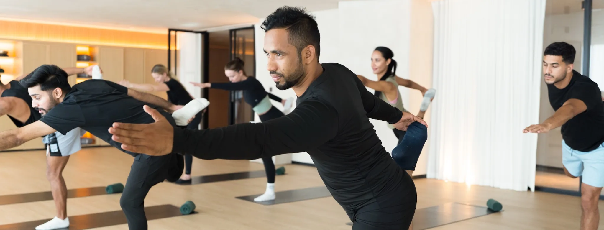 People taking a yoga class.