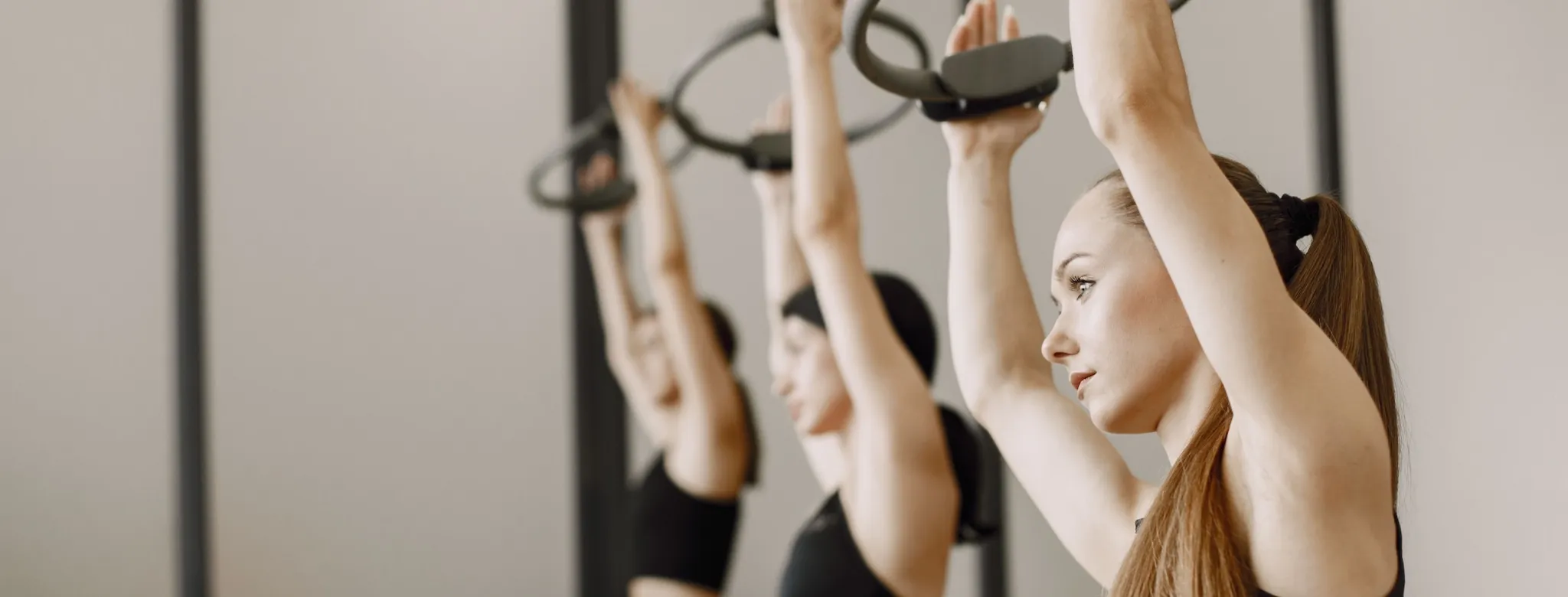 Three women in a fitness class.