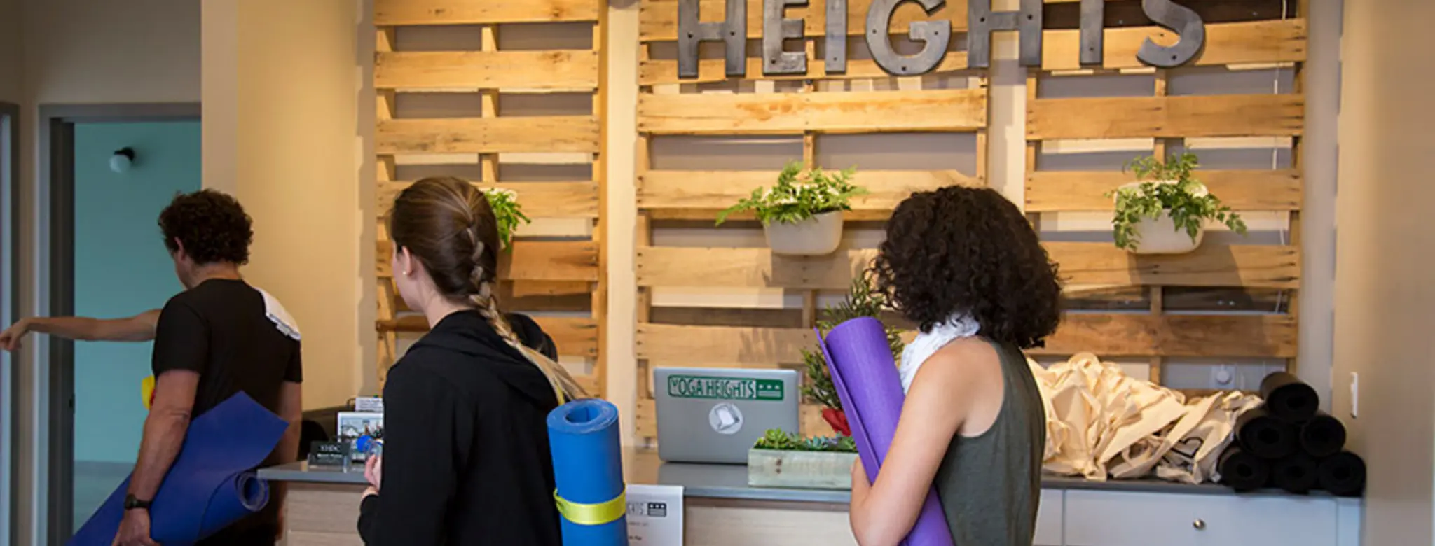 Students checking into class at Yoga Heights