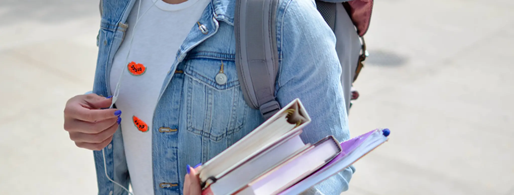 Denver college student with backpack and textbooks