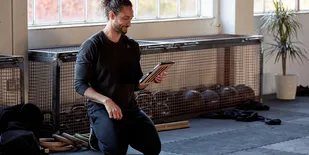 Man creating a Facebook ad on his iPad