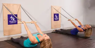 Two women using doing Pilates at IM=X