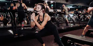 Woman instructing a fitness class at Shred415