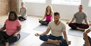 People in studio doing yoga poses